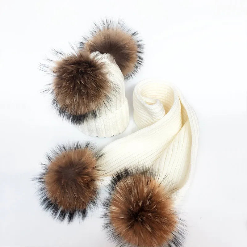 Thin scarf with fur pom moms on the ends. Available in a variety of colors.