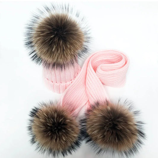 Thin pink scarf with fur pom moms on the ends