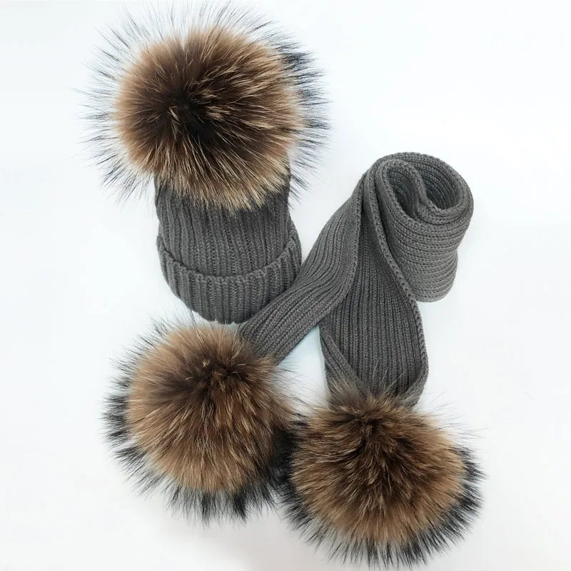 Thin scarf with fur pom moms on the ends. Available in a variety of colors.