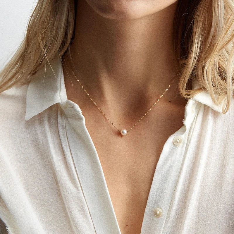 Delicate gold chain drop necklace with medium pearl pendant