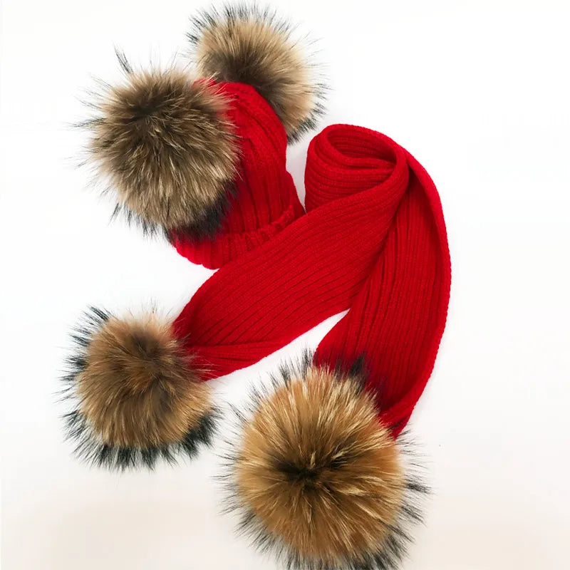 Thin scarf with fur pom moms on the ends. Available in a variety of colors.