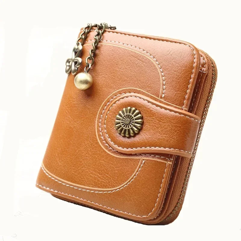 Synthetic Leather wallet with clasp and chain on zipper. Available in a variety of colors